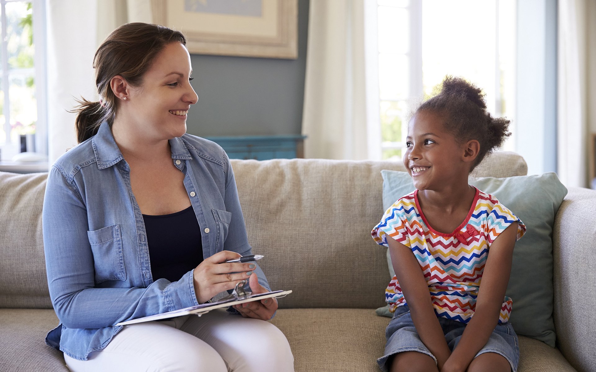 Young Girl Talking With Counselor At Home - Effective Child Therapy